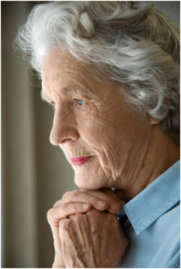 Chubby Grandma In Blue Dress Looks Out The Window Wondering How To Start New Sex Life